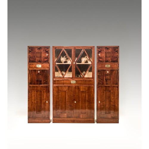 SCHOOL OF PROF. JOSEF HOFFMANN
WIENER KUNST IM HAUS

SUITE OF THREE CABINETS
consisting of: 1 glass-fronted cabinet, a pair of mirrored cabinets
